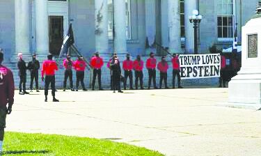 Founder of neo-Nazi group spotted among masked protesters in Concord
